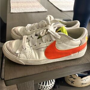 Nike women’s  White and Bright Orange Sneakers